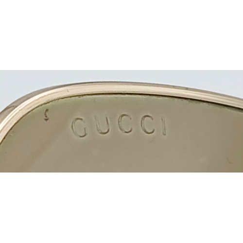 484 - A Pair of Gucci GG0879S Brown Sunglasses. Gold-toned frames with horsebit detailing. Comes with case... 
