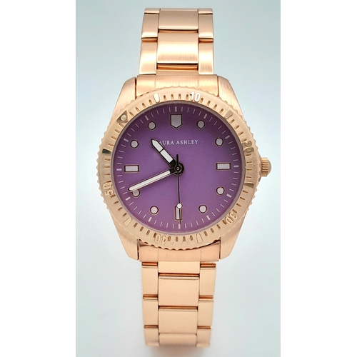 1001 - A LAURA ASHLEY, ROSE GOLD TONE, LILAC DIAL, BRACELET WATCH. IN FULL WORKING ORDER, AS NEW, IN ORIGIN... 