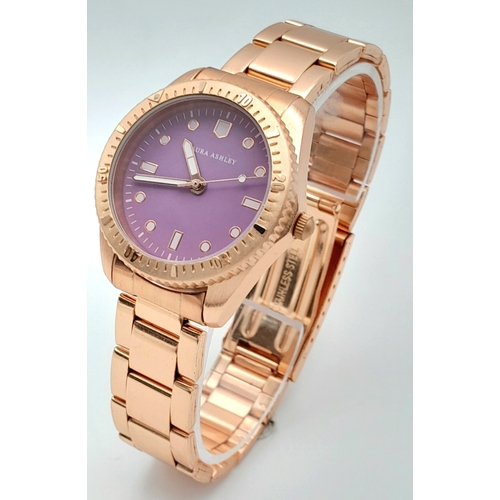 1001 - A LAURA ASHLEY, ROSE GOLD TONE, LILAC DIAL, BRACELET WATCH. IN FULL WORKING ORDER, AS NEW, IN ORIGIN... 