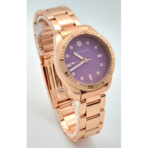 1001 - A LAURA ASHLEY, ROSE GOLD TONE, LILAC DIAL, BRACELET WATCH. IN FULL WORKING ORDER, AS NEW, IN ORIGIN... 