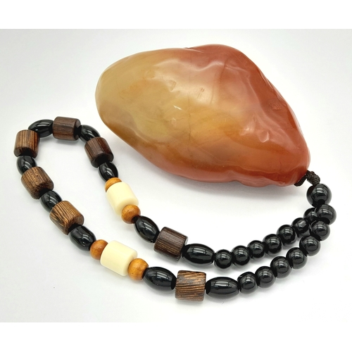 305 - A Shoushan jade stone pendant depicting the Buddha (Amitabha). Height 8 cm; Width 5 cm; Weight 146 g... 