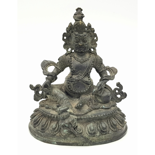 333 - An antique Tibetan Bronze Guardian Deity Figure, .
Depicted wearing armor and a jeweled crown, exudi... 