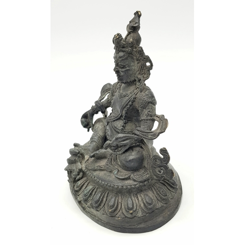 333 - An antique Tibetan Bronze Guardian Deity Figure, .
Depicted wearing armor and a jeweled crown, exudi... 