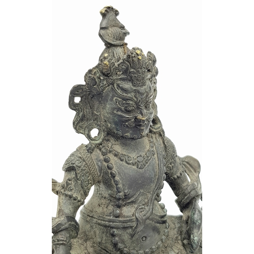 333 - An antique Tibetan Bronze Guardian Deity Figure, .
Depicted wearing armor and a jeweled crown, exudi... 