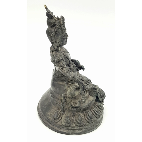 333 - An antique Tibetan Bronze Guardian Deity Figure, .
Depicted wearing armor and a jeweled crown, exudi... 