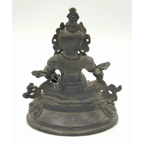 333 - An antique Tibetan Bronze Guardian Deity Figure, .
Depicted wearing armor and a jeweled crown, exudi... 