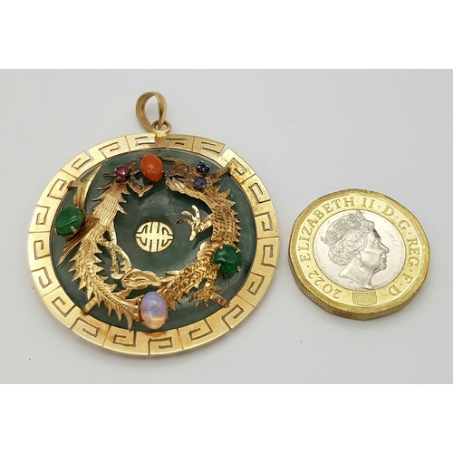 207 - An Antique Chinese Gold and Jade Double Dragon Gem-set Pendant. Greek key decorative border. Stones ... 