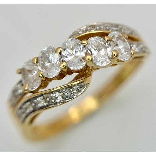 319 - A 14K Yellow Gold White Zircon Crossover Ring. Bright stones. Size Q. 3.25g. Ref: 639121