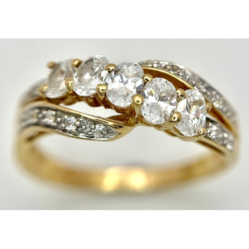 319 - A 14K Yellow Gold White Zircon Crossover Ring. Bright stones. Size Q. 3.25g. Ref: 639121