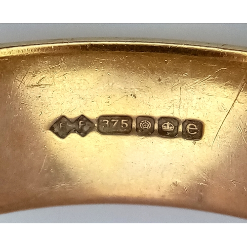 6 - A 9K Yellow Gold Band Ring. 7mm width. UK hallmarks. Size R. 5.3g.