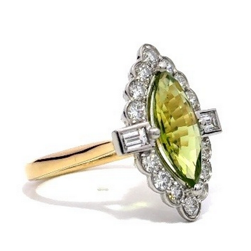 361 - An 18K Yellow Gold and Platinum, natural Peridot and Diamond Ring. Peridot - 2.57ct. Diamond - 0.96c... 