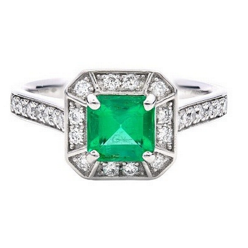 336 - A Platinum natural Colombian Emerald and Diamond Ring. Emerald - 0.62ct. Diamond - 0.26ctw. Size L. ... 