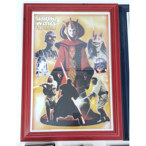 81 - A bundle of Star Wars collectables. To include three framed posters, VHS videos, DVD's, figures and ... 