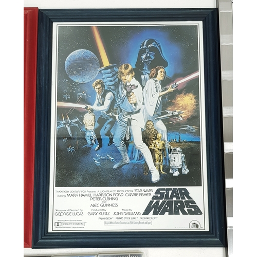 81 - A bundle of Star Wars collectables. To include three framed posters, VHS videos, DVD's, figures and ... 