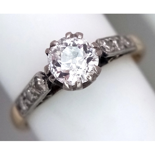 687 - An 18K Yellow Gold Diamond Ring. 0.65ct old European cut centre diamond. Additional diamonds to shou... 