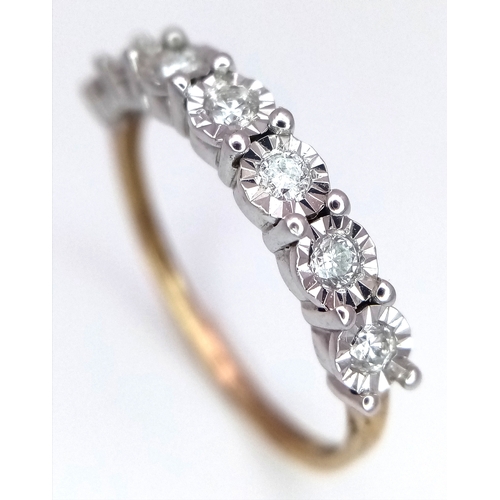 701 - A 9K Gold Seven Stone Diamond Ring. Approximately 0.215ctw, G - H colour diamonds. Size O, 1.5g tota... 