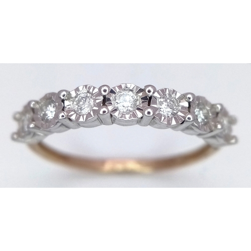701 - A 9K Gold Seven Stone Diamond Ring. Approximately 0.215ctw, G - H colour diamonds. Size O, 1.5g tota... 