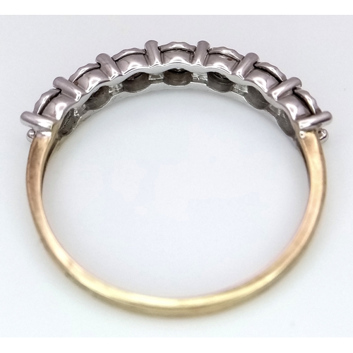 701 - A 9K Gold Seven Stone Diamond Ring. Approximately 0.215ctw, G - H colour diamonds. Size O, 1.5g tota... 