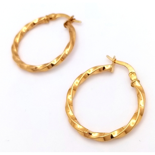 729 - A Pair of 9K Yellow Gold Twist Hoop Earrings. 2.5cm diameter, 1.21g total weight. Ref: NL19/1536