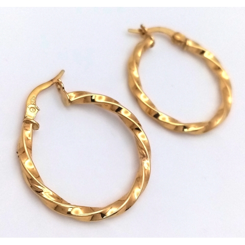 729 - A Pair of 9K Yellow Gold Twist Hoop Earrings. 2.5cm diameter, 1.21g total weight. Ref: NL19/1536