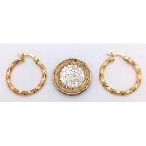 729 - A Pair of 9K Yellow Gold Twist Hoop Earrings. 2.5cm diameter, 1.21g total weight. Ref: NL19/1536
