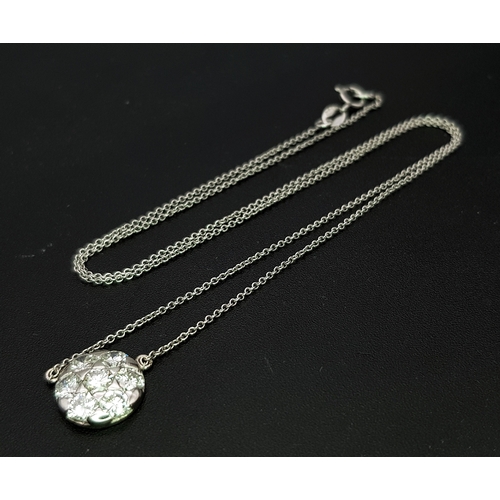 90 - An 18K White Gold and Diamond Circular Lavaliere Pendant on an 18K White Gold Chain. c 1.2ctw of rou... 