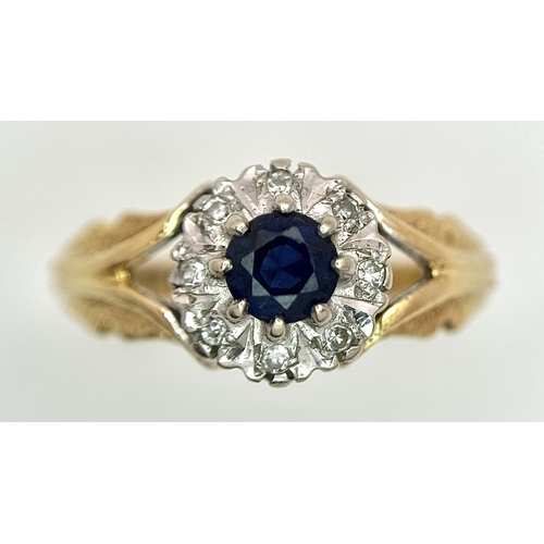 67 - An 18K Yellow Gold Sapphire and Diamond Ring. Oval cut sapphire with a classic diamond halo. Size N.... 