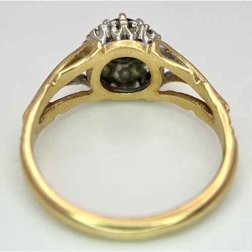 67 - An 18K Yellow Gold Sapphire and Diamond Ring. Oval cut sapphire with a classic diamond halo. Size N.... 