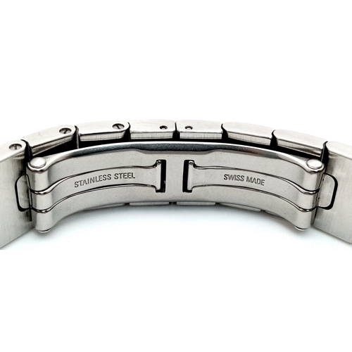 68 - A Cartier Santos Galbee Quartz Ladies Watch. Stainless steel bracelet and case - 24 x 35mm. Ice blue... 