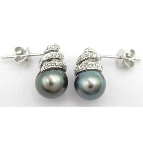73 - A PAIR OF 18K WHITE GOLD, DIAMOND AND PEARL, SPIRAL DESIGN, DROP EARRINGS. 4G. MS RED 1011