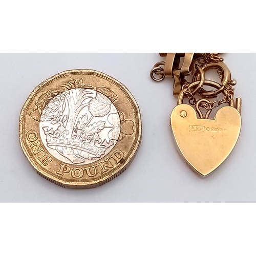 74 - A 9K Yellow Gold Gate Link Bracelet with Heart Clasp. 13mm width. 18cm length. 9.82g.