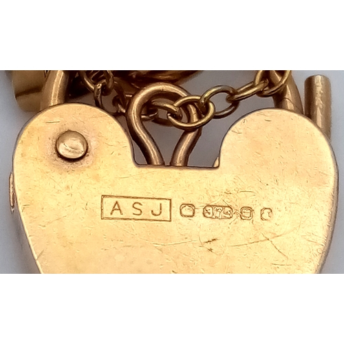 74 - A 9K Yellow Gold Gate Link Bracelet with Heart Clasp. 13mm width. 18cm length. 9.82g.