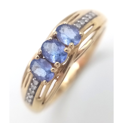 84 - Fully hallmarked 14 CARAT GOLD  TANZANITE RING .2.40 Grams.Size O 1/2 - P.