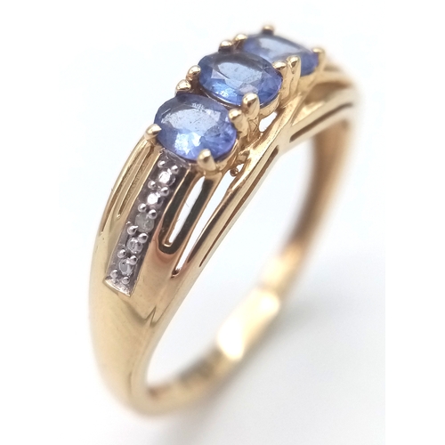 84 - Fully hallmarked 14 CARAT GOLD  TANZANITE RING .2.40 Grams.Size O 1/2 - P.