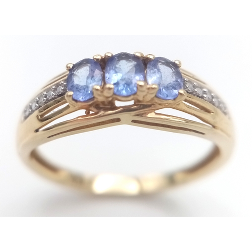 84 - Fully hallmarked 14 CARAT GOLD  TANZANITE RING .2.40 Grams.Size O 1/2 - P.