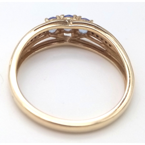 84 - Fully hallmarked 14 CARAT GOLD  TANZANITE RING .2.40 Grams.Size O 1/2 - P.