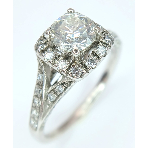 87 - AN 18K WHITE GOLD, DIAMOND SET RING. 1.00 CTW ( MAIN DIAMOND IS 0.65CT ). 3.5G, SIZE L. SPSA 1013