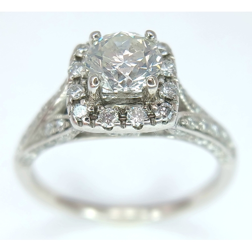 87 - AN 18K WHITE GOLD, DIAMOND SET RING. 1.00 CTW ( MAIN DIAMOND IS 0.65CT ). 3.5G, SIZE L. SPSA 1013