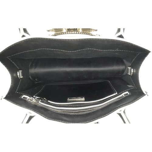 99 - A Miu Miu Black Embellished Handbag. Leather exterior with white stone, faux pearl and stud embellis... 