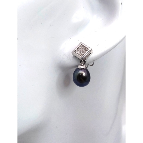 102 - A PAIR OF 14K WHITE GOLD, DIAMOND AND PEARL, DROP EARRINGS. 3.7G. NEEDS ONE BUTTERFLY BACK. MS RED 1... 