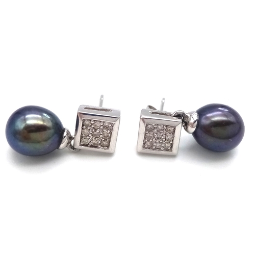 102 - A PAIR OF 14K WHITE GOLD, DIAMOND AND PEARL, DROP EARRINGS. 3.7G. NEEDS ONE BUTTERFLY BACK. MS RED 1... 