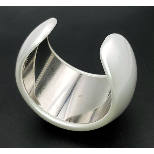 104 - A Chanel Limited Edition Black and Pearl Resin CC Cuff Bracelet. 5cm width at its widest. 57mm inner... 