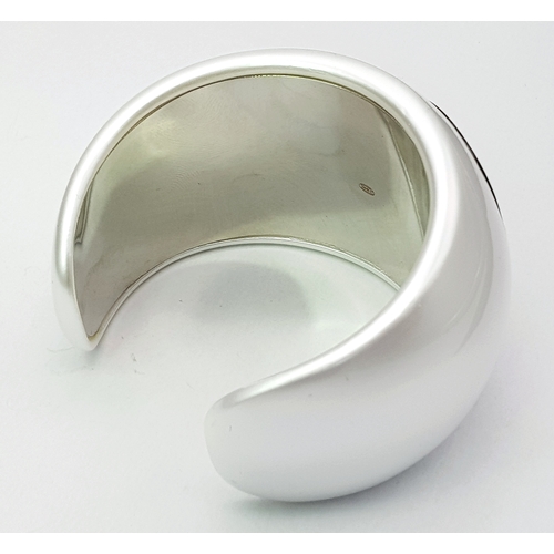 104 - A Chanel Limited Edition Black and Pearl Resin CC Cuff Bracelet. 5cm width at its widest. 57mm inner... 