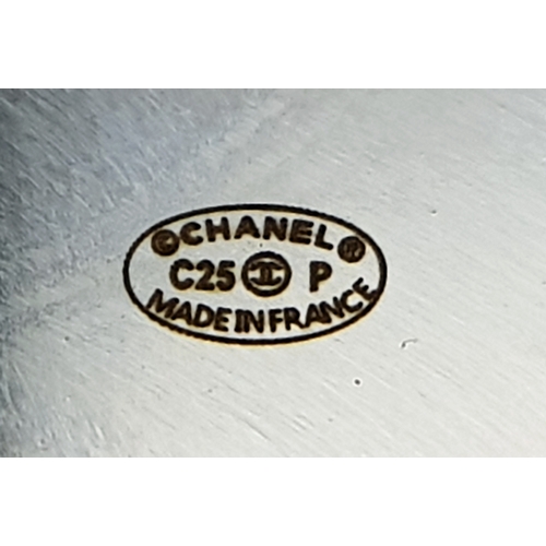 104 - A Chanel Limited Edition Black and Pearl Resin CC Cuff Bracelet. 5cm width at its widest. 57mm inner... 