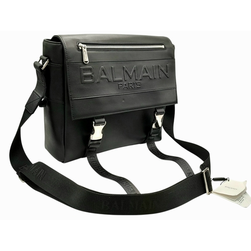 106 - A Balmain Black Leather Messenger Bag. Crafted from smooth black leather with an embossed “BALMAIN P... 