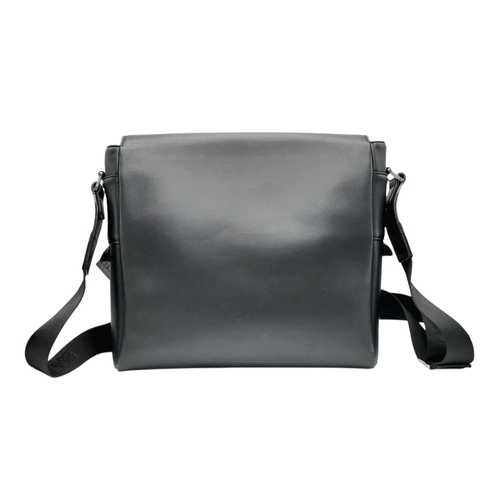 106 - A Balmain Black Leather Messenger Bag. Crafted from smooth black leather with an embossed “BALMAIN P... 