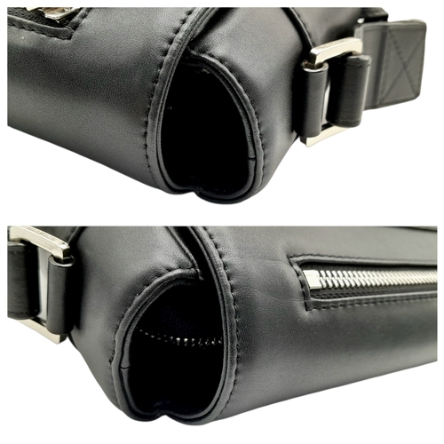 106 - A Balmain Black Leather Messenger Bag. Crafted from smooth black leather with an embossed “BALMAIN P... 
