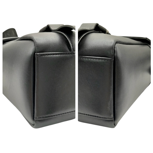 106 - A Balmain Black Leather Messenger Bag. Crafted from smooth black leather with an embossed “BALMAIN P... 