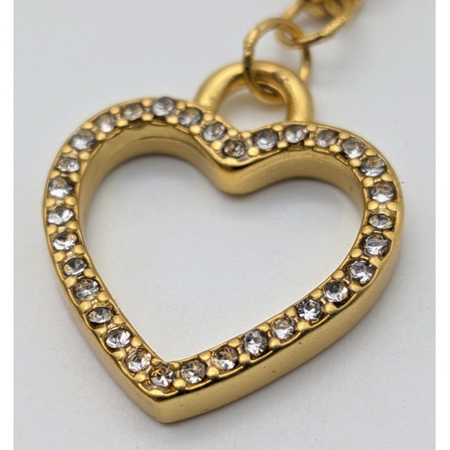 111 - A Dolce & Gabbana Logo and Hearts Necklace and Earrings Set. From the Italian Tailoring Collection. ... 