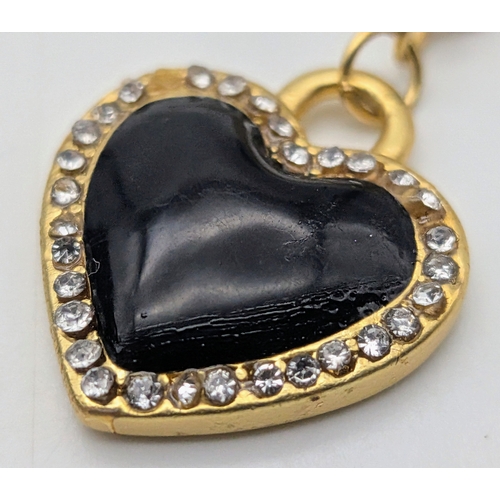 111 - A Dolce & Gabbana Logo and Hearts Necklace and Earrings Set. From the Italian Tailoring Collection. ... 